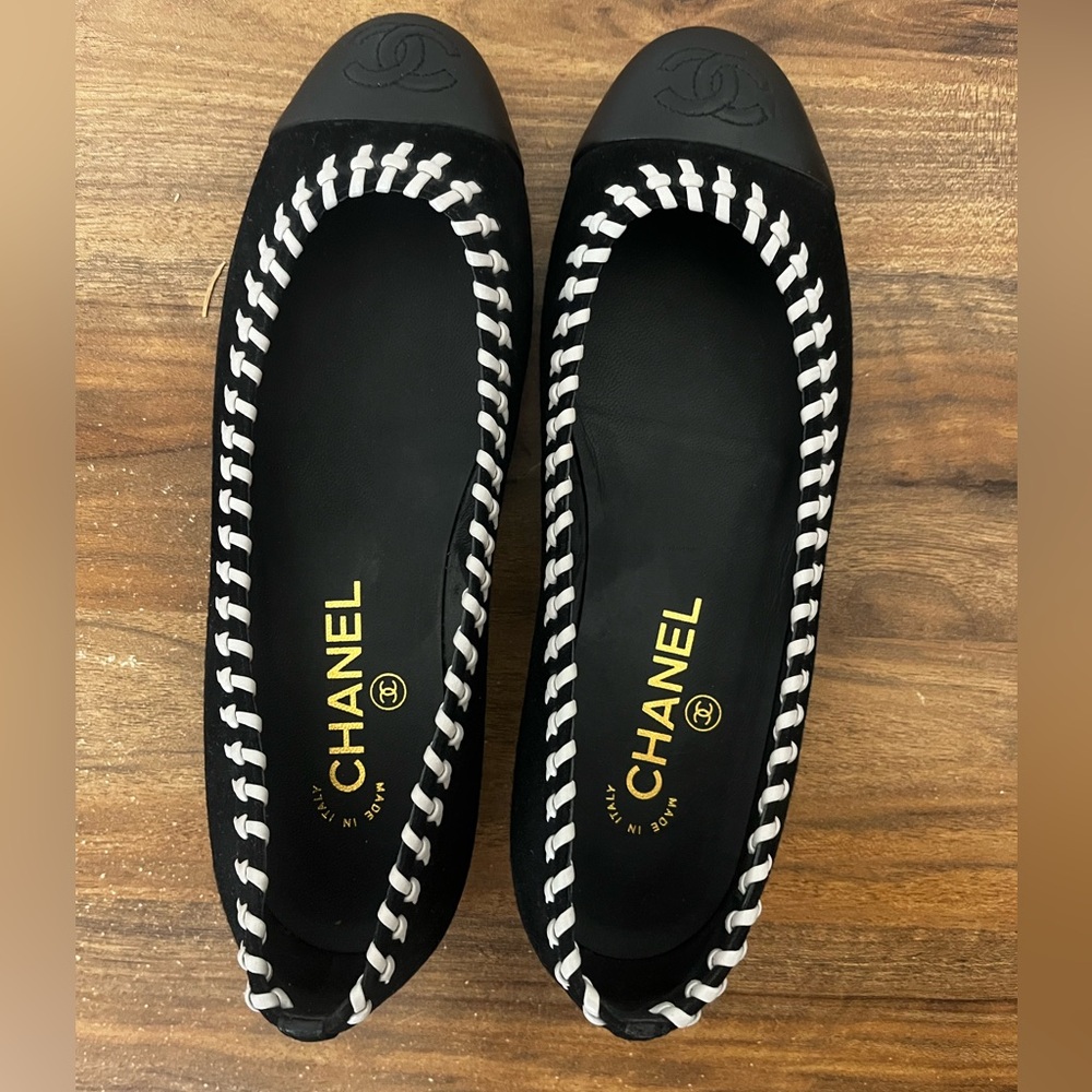 CHANEL Black and White Flats with Striking Stripes